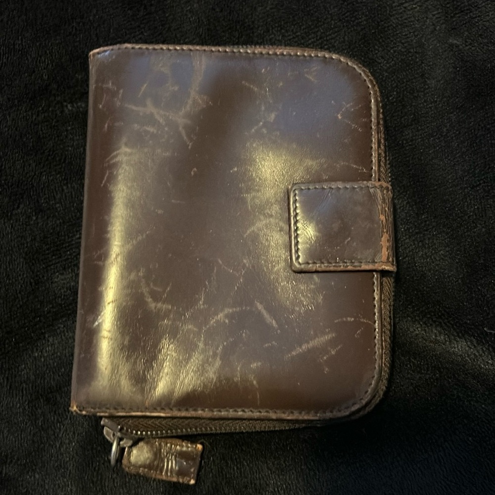 Used Prada Leather wallet the scratches around ther outside,noticeable up close